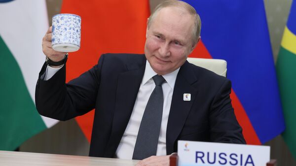 Russian President Vladimir Putin makes a toast as he takes part in a virtual format at the opening ceremony of the BRICS Business Forum via videoconference in Moscow region, in Moscow, Russia, Thursday, June 23, 2022.  - Sputnik Africa