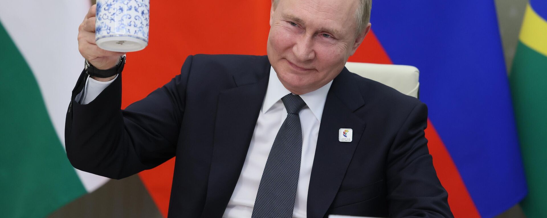 Russian President Vladimir Putin makes a toast as he takes part in a virtual format at the opening ceremony of the BRICS Business Forum via videoconference in Moscow region, in Moscow, Russia, Thursday, June 23, 2022.  - Sputnik Africa, 1920, 31.05.2023