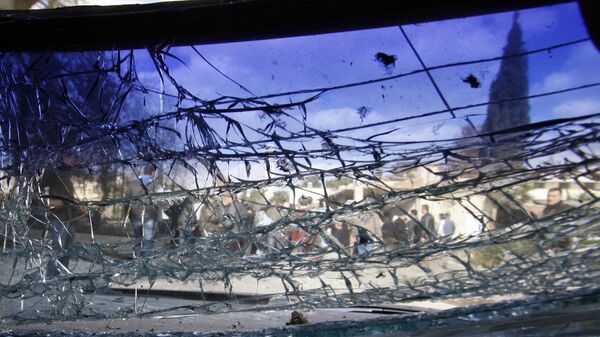 A cracked windshield is seen at the site of a suicide bombing in Damascus, Syria, Friday, Dec. 23, 2011. - Sputnik Africa