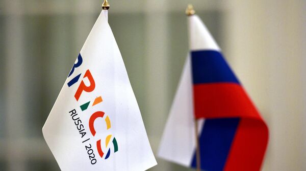 Russian and BRICS flags at the 1st BRICS Sherpa/Sous Sherpa meeting in St. Petersburg. - Sputnik Africa