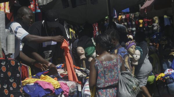 Women buys clothes inside a market in Lagos, Nigeria, Monday June 7, 2021. - Sputnik Africa