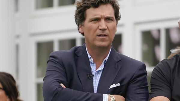 Tucker Carlson attends the final round of the Bedminster Invitational LIV Golf tournament in Bedminster, N.J., Sunday, July 31, 2022. - Sputnik Africa