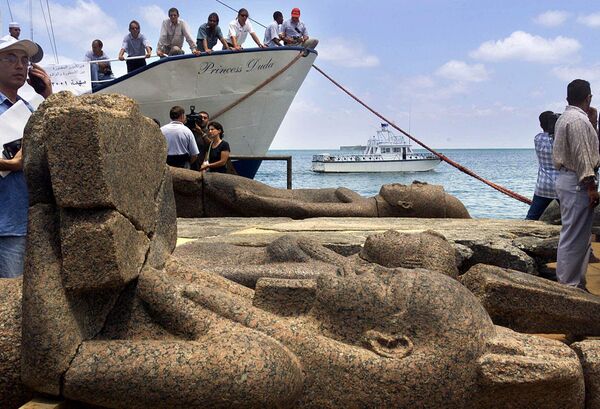 A large statue of the god Hapi, foreground, and other two unidentified statues lay on the deck of a boat in Alexandria, Egypt Thursday, June 7, 2001, after a French underwater archaeological team raised them to the surface along with other precious items that had laid hidden in the murky depths. Researchers said Thursday, they have only just begun to probe the extraordinary treasures of the sunken city of Herakleion. More than 1,000 years ago, an earthquake sent the Pharaonic city of Heracleion to the bottom of the Mediterranean.   - Sputnik Africa