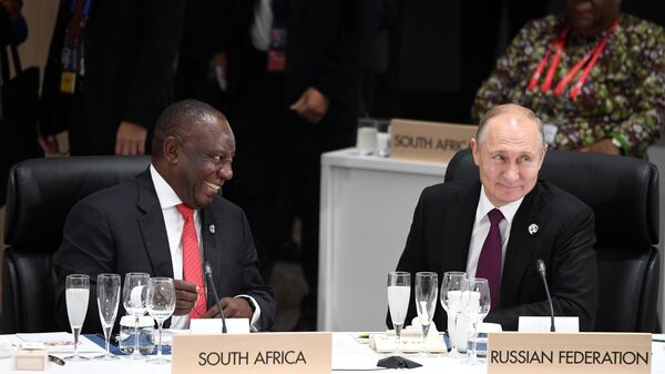Russian President Vladimir Putin at the first working meeting of the heads of delegations of the G20 member states, invited states and international organizations in Osaka. Left: President of the Republic of South Africa Cyril Ramaphosa. - Sputnik Africa