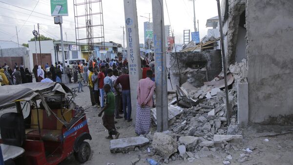 Somalis stand outside the destroyed Pearl Beach hotel in Mogadishu, Somalia , Saturday, June 10, 2023 - Sputnik Africa