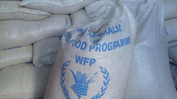 In this photo of Monday, Aug. 8, 2011 sacks of World Food Program, WFP, food is seen on a truck before being dropped off for storage in warehouses in the former Somali water agency that runs the biggest sell off of food aid in Mogadishu. - Sputnik Africa