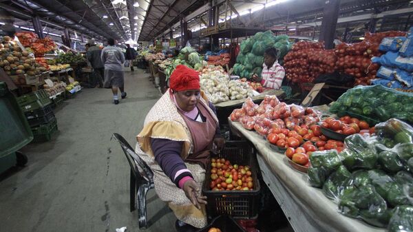A woman sells vegetables at the early morning market Thursday, June 24, 2010, in Durban, South Africa.  - Sputnik Africa