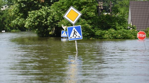 Road signs on the street in the town of Golaya Prystan in the Kherson region after flooding of the Kakhovka hydroelectric power plant (HPP), on June 08, 2023. - Sputnik Africa