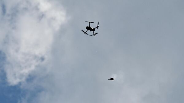 A drone drops a projectile during an exercise in the Gomel region. - Sputnik Africa