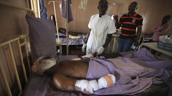 A doctor attends to Umaru Garba,  a victim of a bomb explosion, as receives  treatment at St Gerard's catholic hospital in Kaduna, Nigeria, Monday, April 9, 2012 - Sputnik Africa