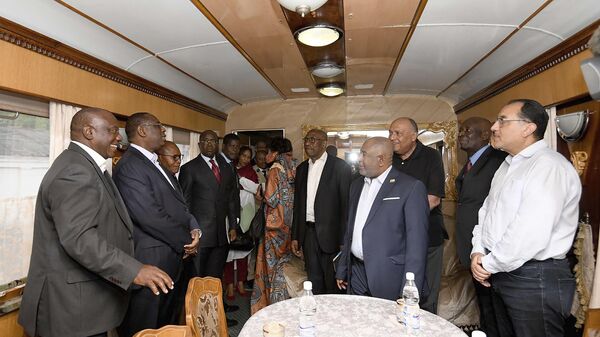 In this photo provided by the South African Government Communications and Information Services (GCIS) South African President Cyril Ramaphosa, left, and other delegates travel on a train towards Kyiv, from Warsaw, Poland, Thursday, June 15, 2023.  - Sputnik Africa