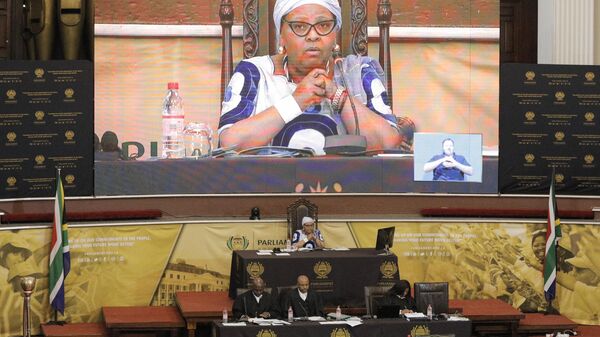 Speaker of the South African National Assembly Nosiviwe Mapisa-Nqakula (C back) presides over a debate to the possibility of initiating proceedings to remove South African President Cyril Ramaphosa from office, at a parliamentary session in Cape Town on December 13, 2022. Ramaphosa, who was championed as a graft-busting saviour after the corruption-tainted tenure of predecessor Jacob Zuma, has been marred by accusations that he attempted to cover up a huge cash theft at his luxury farm. ( - Sputnik Africa