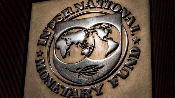 The logo of the International Monetary Fund is visible on their building, Monday, April 5, 2021, in Washington. The International Monetary Fund is downgrading its forecast for the world economy this year, Tuesday, Jan. 25, 2022 - Sputnik Africa
