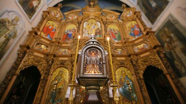 A lamp containing the Holy Fire delivered from Jerusalem to the Holy Resurrection Church near the Kiev-Pechersk Lavra. File photo. - Sputnik Africa