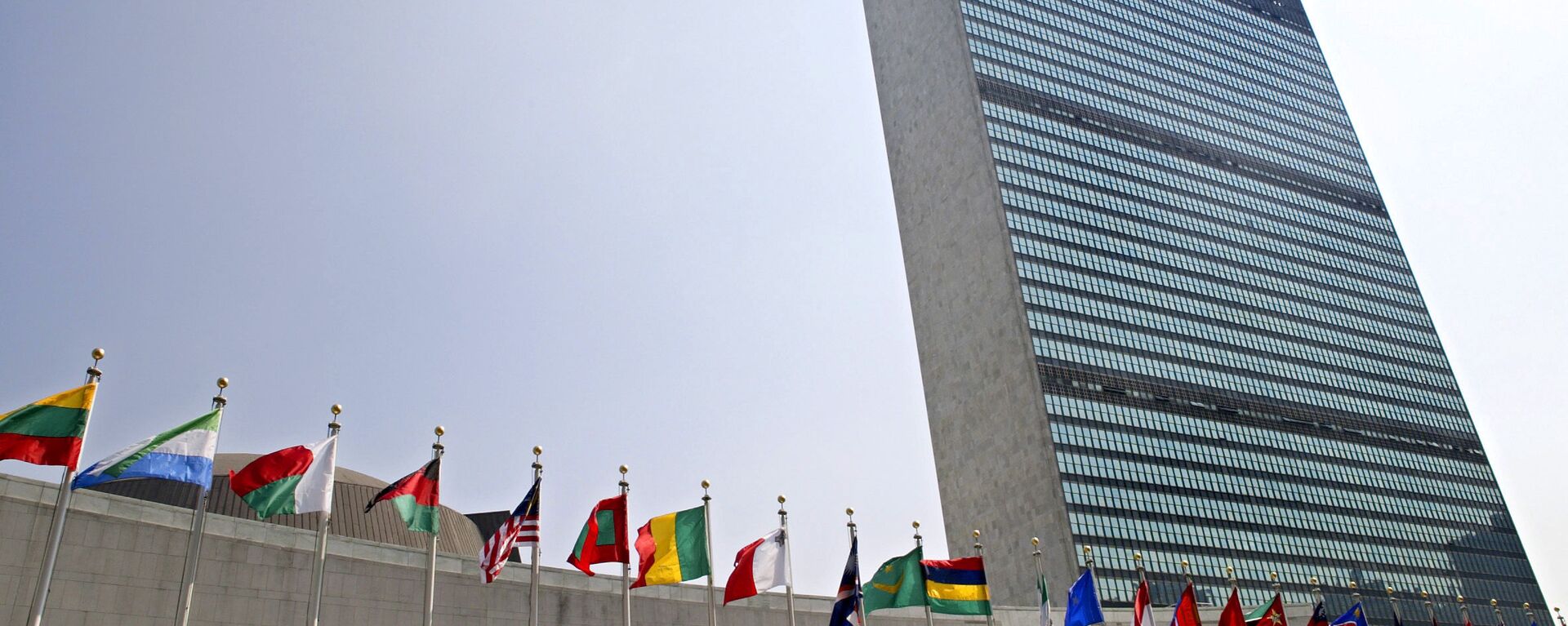 In this Sept. 13, 2005, file photo, the flags of member nations fly outside the General Assembly building at the United Nations headquarters in New York. - Sputnik Africa, 1920, 05.09.2023