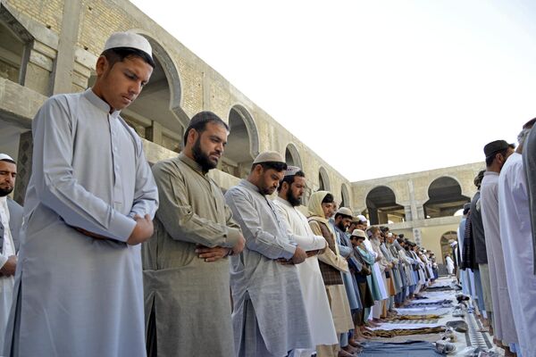 Men pray at a mosque ahead of the Muslim festival Eid al-Adha in Shahidan Square of Kandahar on June 28, 2023. - Sputnik Africa