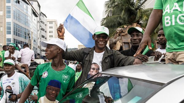 Supporters of the President of Sierra Leone and leader of Sierra Leone People’s party (SLPP), Julius Maada Bio, celebrate on the streets following his re-election, in Freetown, on June 27, 2023. - Sputnik Africa
