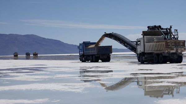 A track is loaded with salt at a semi-industrial plant to produce potassium chloride, used to manufacture batteries based on lithium, after its opening ceremony at the Uyuni salt desert, outskirts of Llipi, Bolivia, Thursday, Aug. 9, 2012. The salt flats of Uyuni have triggered international interest among energy companies due to its lithium reserves - Sputnik Africa