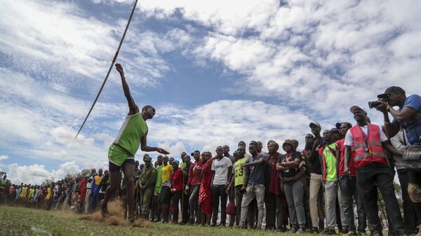 A Maasai man throws a javelin as he competes in the Maasai Olympics in Kimana Sanctuary, southern Kenya Saturday, Dec. 10, 2022. - Sputnik Africa