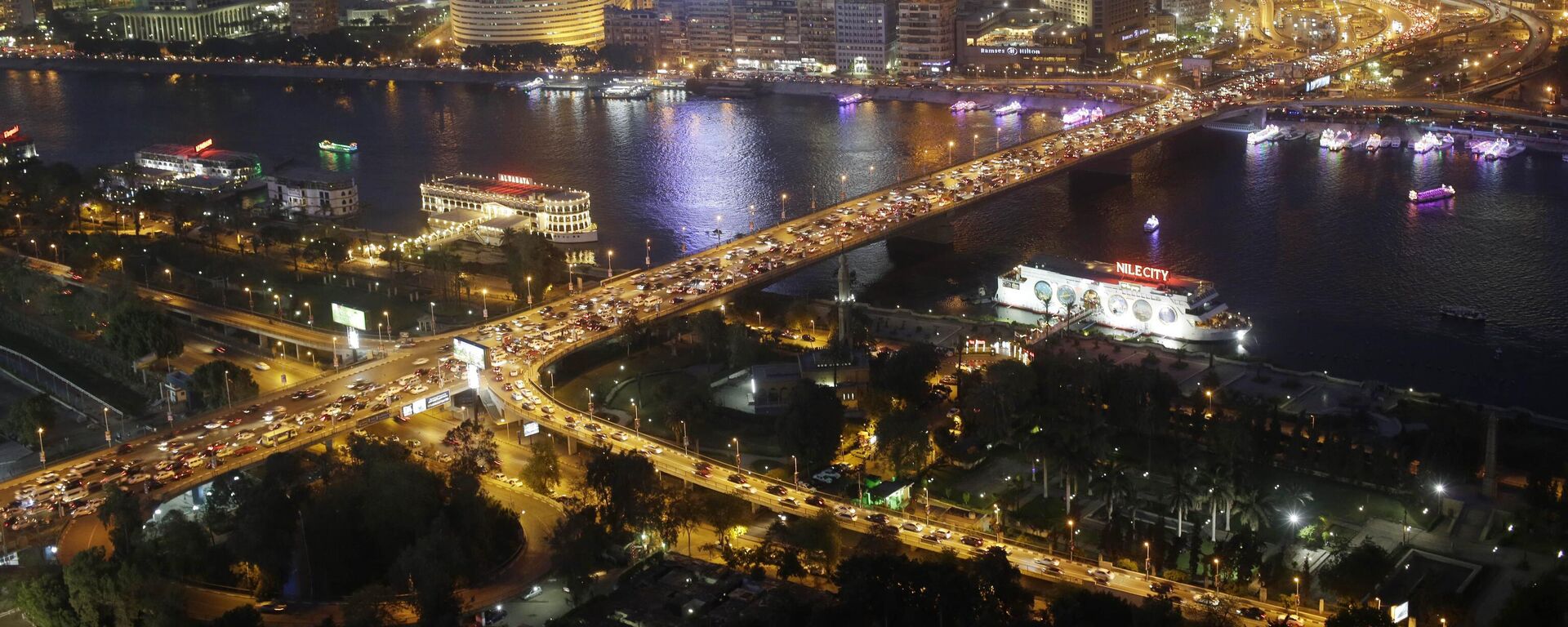 In this Tuesday, May 5, 2015, file, photo, rush hour traffic fills the 6 October bridge over the Nile River in Cairo, Egypt - Sputnik Africa, 1920, 06.07.2023