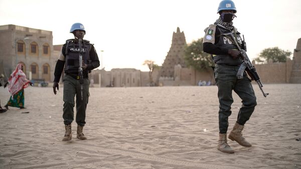 Nigerian Policemen of the United Nations Stabilisation Mission in Mali (MINUSMA) patrol on the main square in Timbuktu on December 8, 2021 - Sputnik Africa