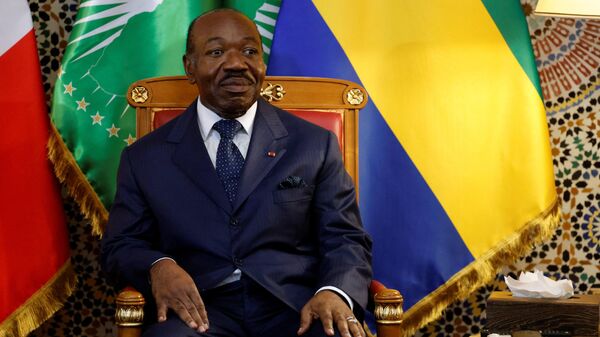 Gabon's President Ali Bongo Ondimba listens to French President Emmanuel Macron (not seen) during a bilateral meeting at Presidential Palace in Libreville, on March 1, 2023.  - Sputnik Africa