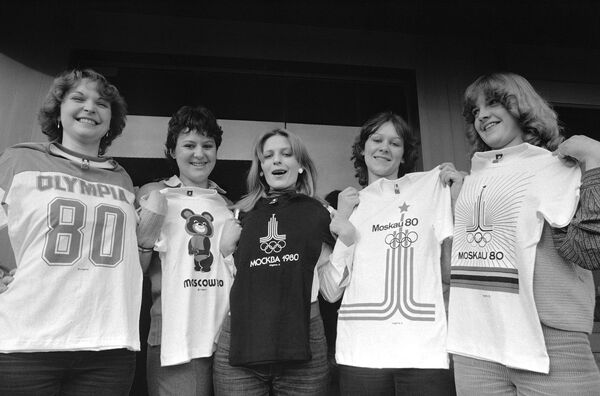 Models of clothing plant near Stuttgart  Feb. 1, 1980, hold five different t-shirts with emblems of the Moscow Olympics 1980 which are produced by the factory for German language countries. According to factory manager there was no loss in selling Olympic souvenirs so far, unaffected by boycott plans of Western countries. - Sputnik Africa