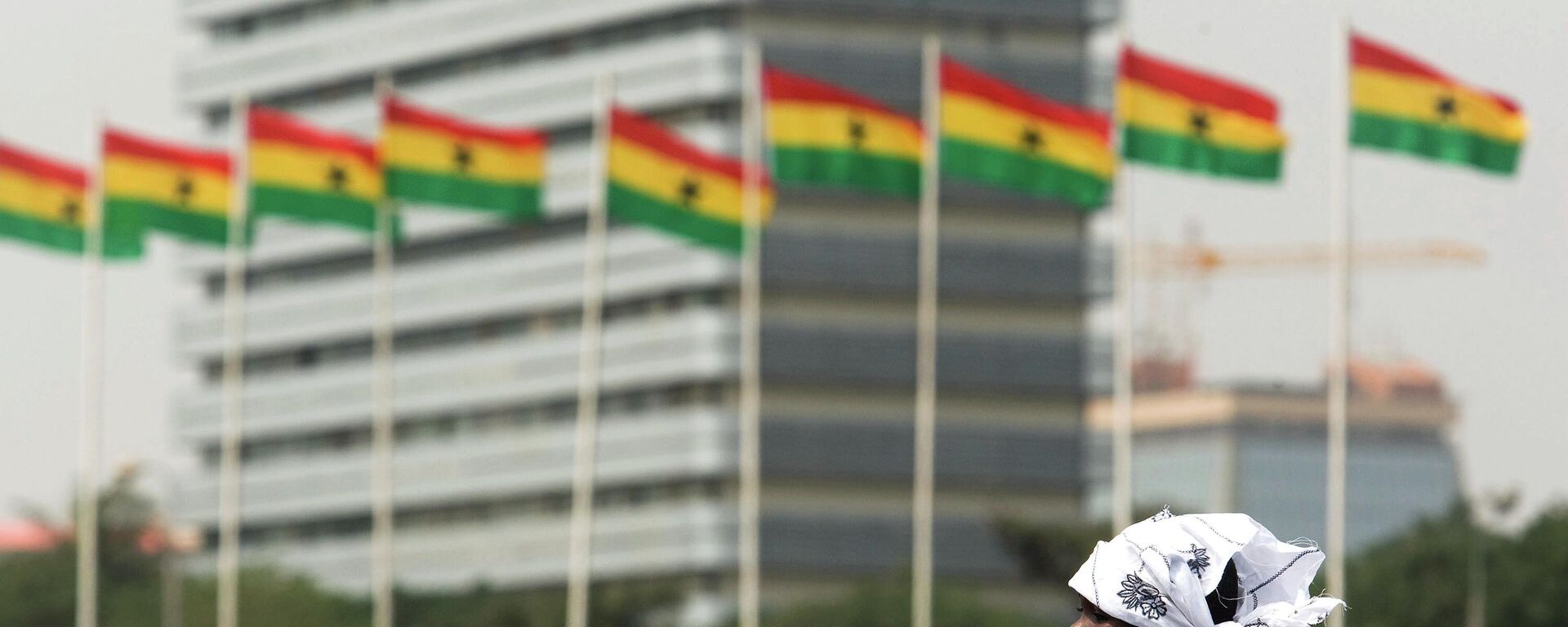 A girl sits on an adult's shoulders to get a better view as she waits among a crowd prior to the ceremony held for the inauguration of Ghana's new President John Atta Mills in Accra, Ghana Wednesday, Jan. 7, 2009.  - Sputnik Africa, 1920, 12.10.2023