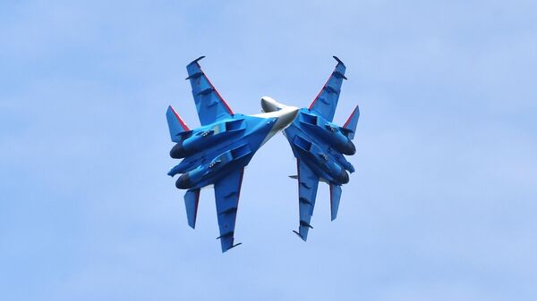 Sukhoi Su-30SM fighter jets of the Russian Knights aerobatic team fly in formation over the Cathedral of the Resurrection of Christ, the main Orthodox cathedral of the Russian Armed Forces, during an event dedicated to the 110th anniversary of the creation of the Russian Air Force, near Kubinka, Moscow Region, Russia, on August 12, 2022. - Sputnik Africa