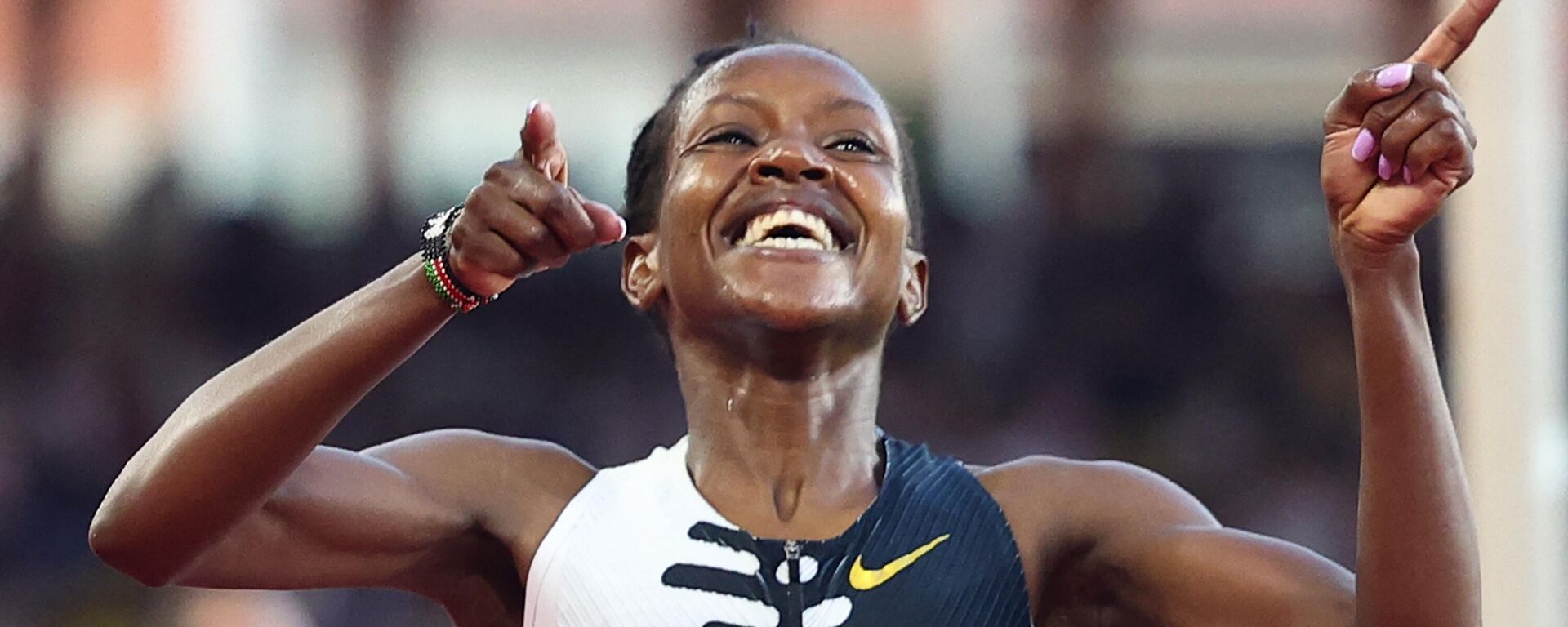 Faith Kipyegon of Kenya celebrates after breaking the World Record and winning in the Women's One Mile event during the IAAF Diamond League Herculis athletics meeting at the Louis II Stadium in Monaco, on July 21, 2023 - Sputnik Africa, 1920, 22.07.2023