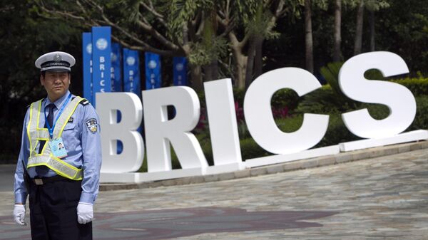 A traffic policeman stands watching outside a venue of BRICS Summit in Sanya, China Wednesday, April 13, 2011.  - Sputnik Africa