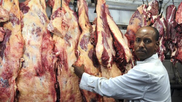 In this photo of Saturday June 11, 201 a butcher arranging meat in his shop in Addis Ababa Ethiopia. - Sputnik Africa