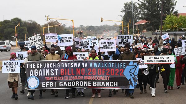 Demonstrators from the Coalition of Botswana Christian Churches chants slogans against homosexuality and hold placards while marching toward the Parliament of Botswana on July 22, 2023 protesting against legislation seeking to make same-sex relation legal.  - Sputnik Africa