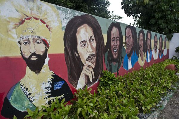 A mural depicting (L to R)  Ethiopian Emperor Haile Selassie I, Jamaican Reggae legend Bob Marley and his seven sons is seen on the ground of his museum in Kingston on June 30, 2012. Jamaica will celebrate its 50th anniversary as an independent state on August 6, 2012. - Sputnik Africa