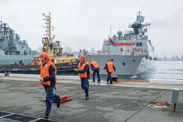 Port employees during the arrival of four PLA Navy ships on a visit after the joint Russian-Chinese exercise &quot;North/Interaction-2023&quot; to the Russian port of Vladivostok. The exercise took place in the Sea of Japan. - Sputnik Africa