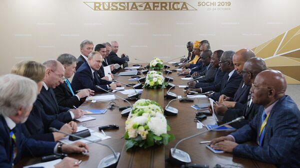 Russian President Vladimir Putin and President of the Republic of Guinea Alpha Conde during a meeting on the sidelines of the Russia-Africa summit on October 24, 2019.  - Sputnik Africa