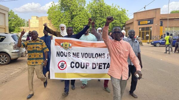 Supporters of Nigerien President Mohamed Bazoum demonstrate in his support in Niamey, Niger, Wednesday July 26, 2023.  - Sputnik Africa