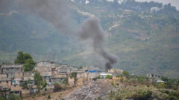 Smoke rises in the Turgeau commune of Port-au-Prince, Haiti, during gang-related violence on April 24, 2023 - Sputnik Africa