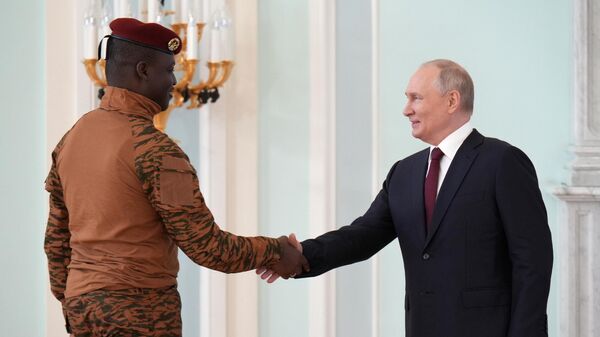 Russian President Vladimir Putin and President of the Transitional Period of the Republic of Burkina Faso Ibrahim Traore during a meeting - Sputnik Africa