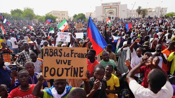 Nigeriens participate in a march called by supporters of coup leader Gen. Abdourahmane Tchiani in Niamey, Niger, Sunday, July 30, 2023. - Sputnik Africa