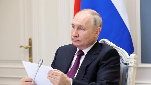 Russian President Vladimir Putin takes part in the ceremony of signing an agreement on the construction of the Rasht-Astara railway, which is a part of the International North-South Transport Corridor, via a video link together with Iranian President Ebrahim Raisi, at the Kremlin, in Moscow, Russia, on May 17, 2023. - Sputnik Africa