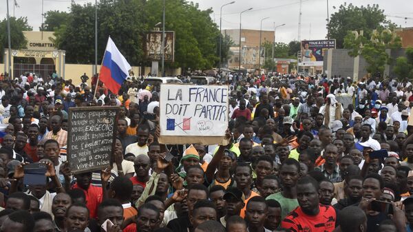 Protesters hold an anti-France placard during a demonstration on independence day in Niamey on August 3, 2023. Security concerns built on August 3, 2023 ahead of planned protests in coup-hit Niger, with France demanding safety guarantees for foreign embassies as some Western nations reduced their diplomatic presence. - Sputnik Africa