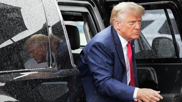Former President Donald Trump arrives to board his plane at Ronald Reagan Washington National Airport, Thursday, Aug. 3, 2023, in Arlington, Va., after facing a judge on federal conspiracy charges that allege he conspired to subvert the 2020 election - Sputnik Africa