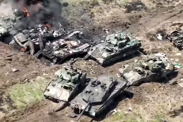 Leopard 2 and Bradley pictured among destroyed and damaged Ukrainian vehicles. Screenshot of Russian Defense Ministry video. - Sputnik Africa