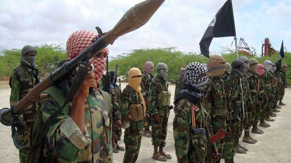 In this file photo of Thursday Oct.21, 2010, Al-Shabaab fighters display weapons as they conduct military exercises in northern Mogadishu, Somalia - Sputnik Africa