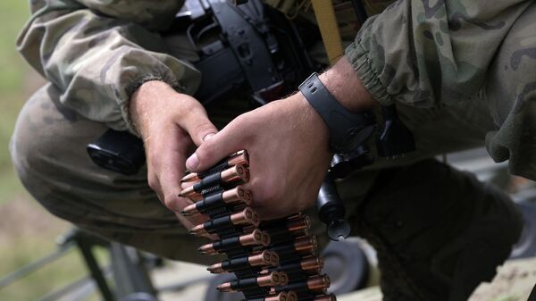 Russian servicemen of a volunteer unit of Central Military District load ammunition into a BMP-3 infantry fighting vehicle during a combat training in the course of Russia's military operation in Ukraine - Sputnik Africa