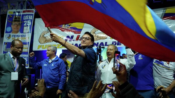 Presidential candidate Fernando Villavicencio waves an Ecuadorean  flag during a campaign event at a school minutes before he was shot to death outside the same school in Quito, Ecuador - Sputnik Africa