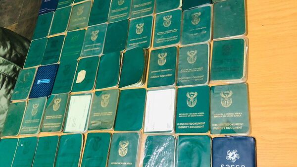 A suspect was arrested in possession of 98 identity documents and more than 100 bank cards in Selosesha, Free State, South Africa.  - Sputnik Africa