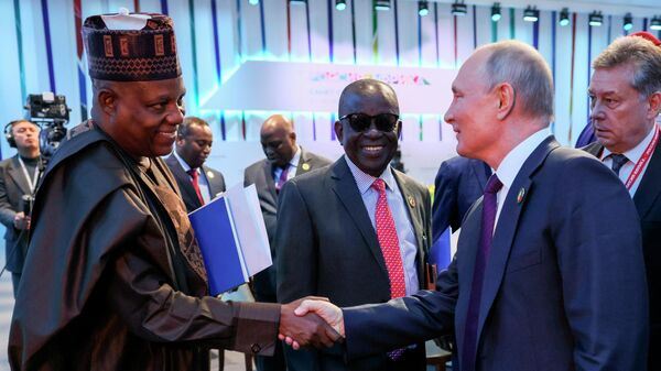 Vice-President of the Federal Republic of Nigeria Kashim Shettima, left, and Russian President Vladimir Putin shake hands after a plenary session at the Russia Africa Summit in St. Petersburg, Russia, Friday, July 28, 2023. - Sputnik Africa