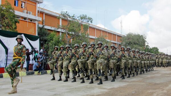 Soldiers parade in front of President Mohamed Abdullahi Mohamed at the ministry of defense in Mogadishu, Somalia Tuesday, April 12, 2022. - Sputnik Africa